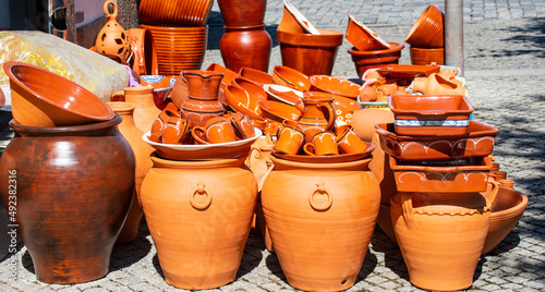 Terracotta pots and jars for sale on the street of evora city, portugal © Nina