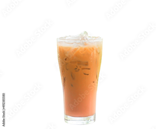 Iced orange Thai milk Tea in transparent glass isolated on white background