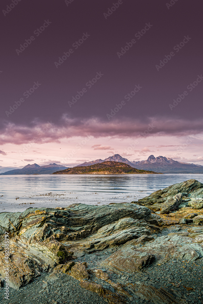 Cover page over beautiful sunset at Ensenada Zaratiegui Bay in Tierra del Fuego National Park, Beagle Channel, Patagonia, Argentina, early Autumn.