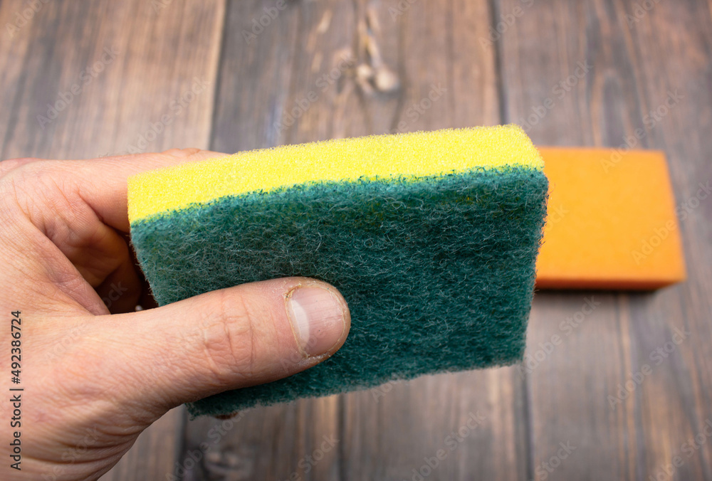 Foam sponges. Sponges for washing dishes. Multi-colored sponges are soft. - obrazy, fototapety, plakaty 