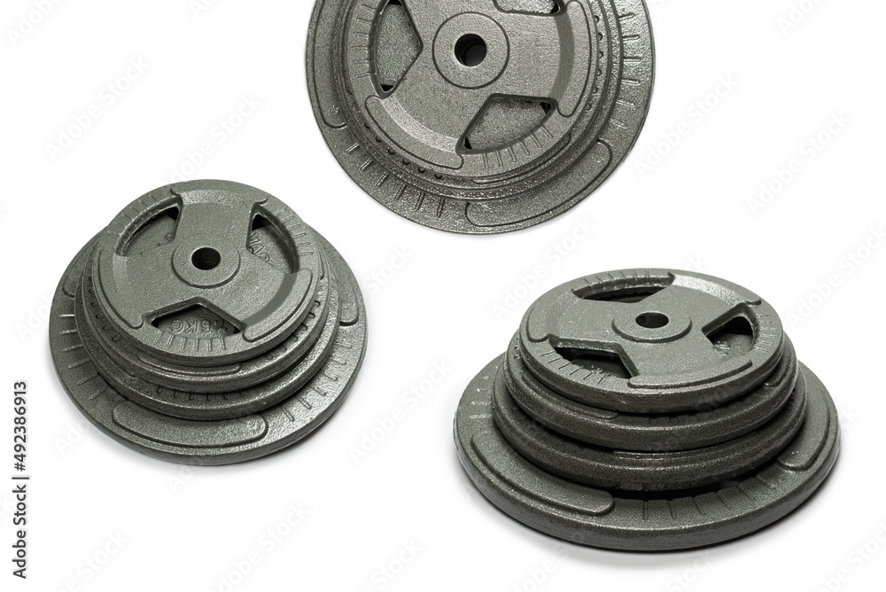 Weight plates isolated on a white background. Weight plates isolated on a white background.