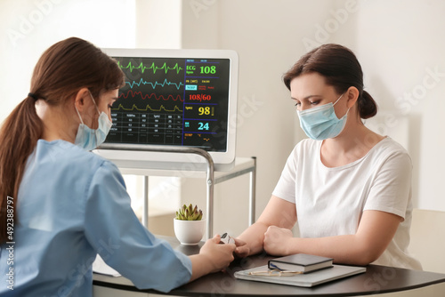 Doctor measuring oxygen sat...