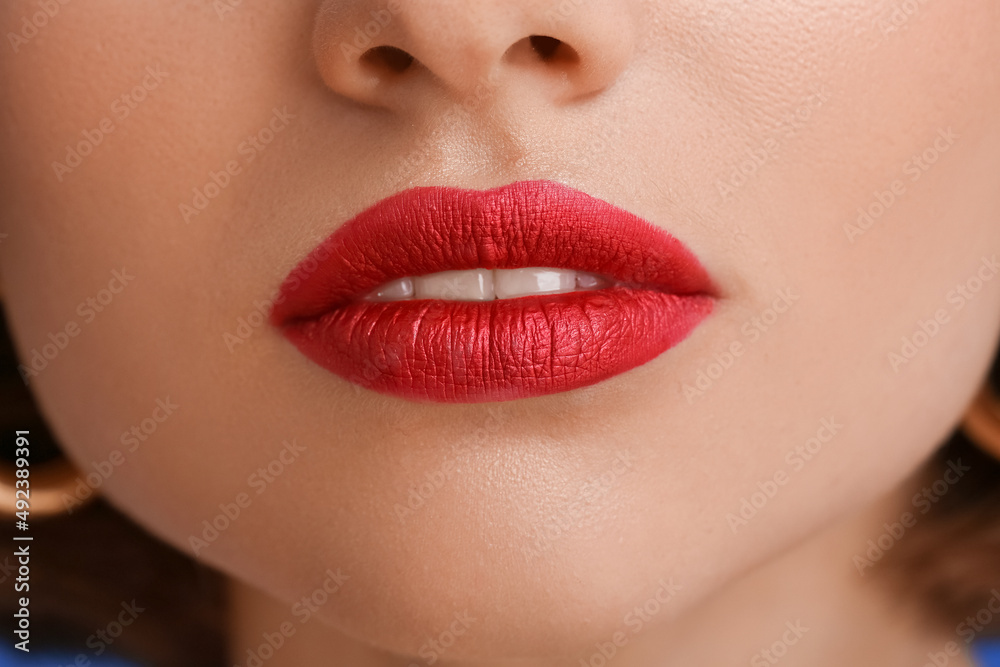 Young beautiful woman with red lipstick, closeup Young beautiful woman with red lipstick, closeup