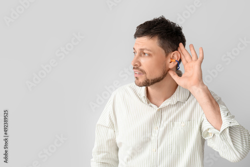 Handsome man with ear plugs...