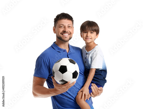 Male trainer with soccer ba...