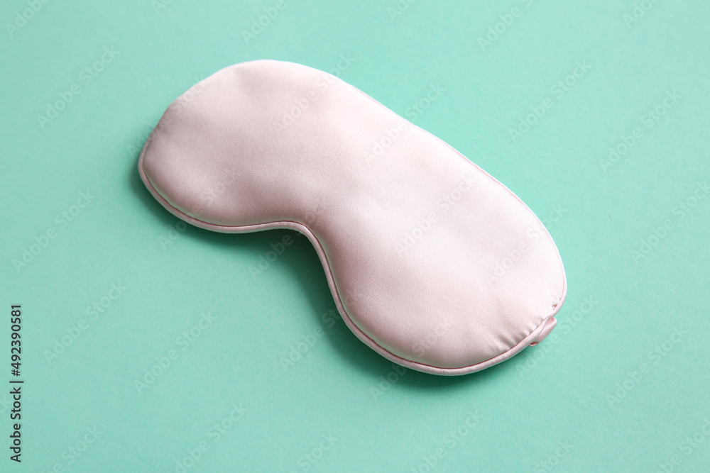 Sleep mask on green background Sleep mask on green background