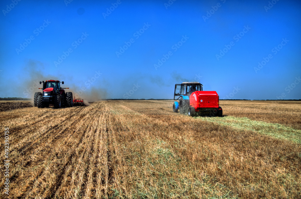 Obraz premium Tractor plowing in the field