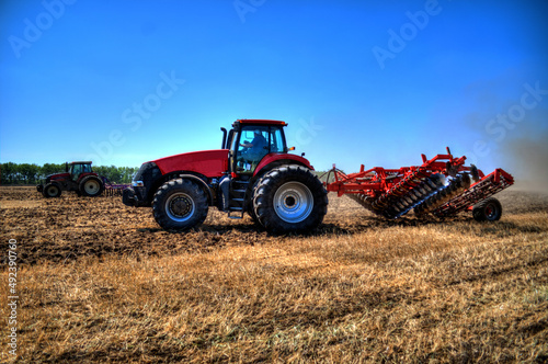 Tractor plowing in the field
