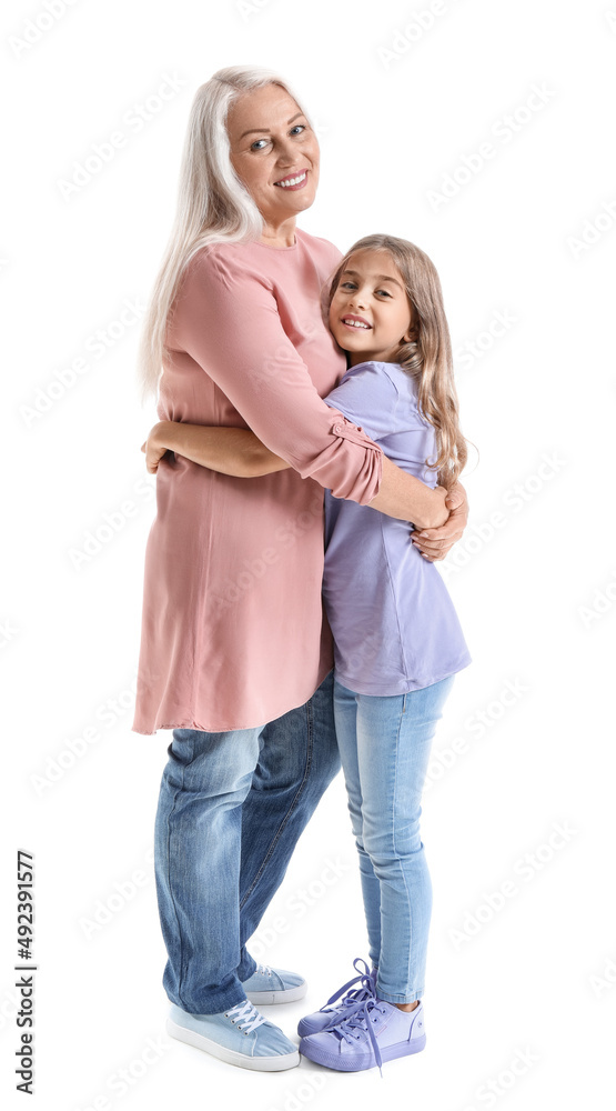 Happy little girl hugging her grandma on white background Happy little girl hugging her grandma on white background