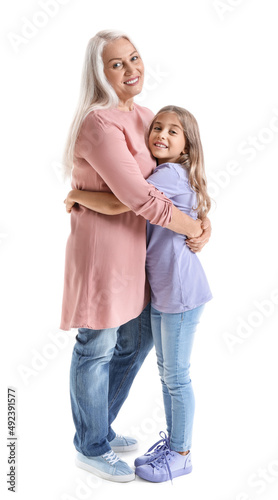 Happy little girl hugging her grandma on white background