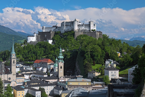Salzburg, Austria. Hohensalzburg fortress on top of Festungsberg mountain, and church towers of Salzburg Old Town. View from observation point at Monchsberg mountain. photo