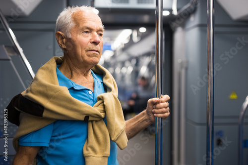 Portrait of man traveling in subway train during daily