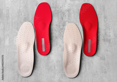 Orthopedic insoles on grunge background