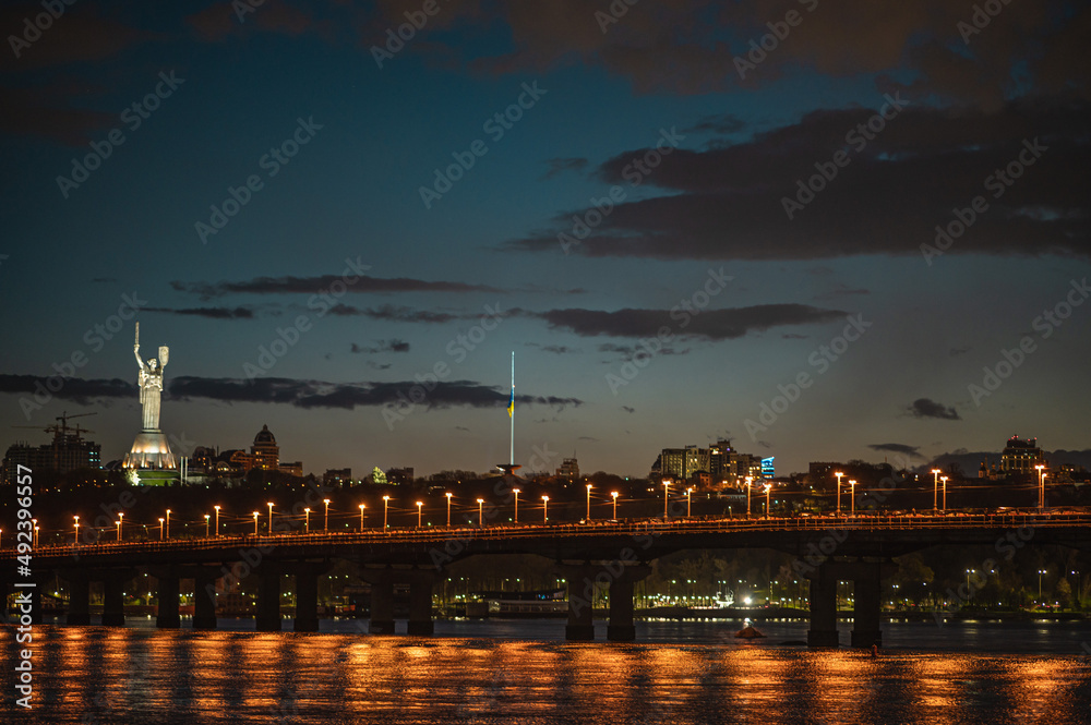 evening view of the Paton bridge, motherland, right bank of Kyiv