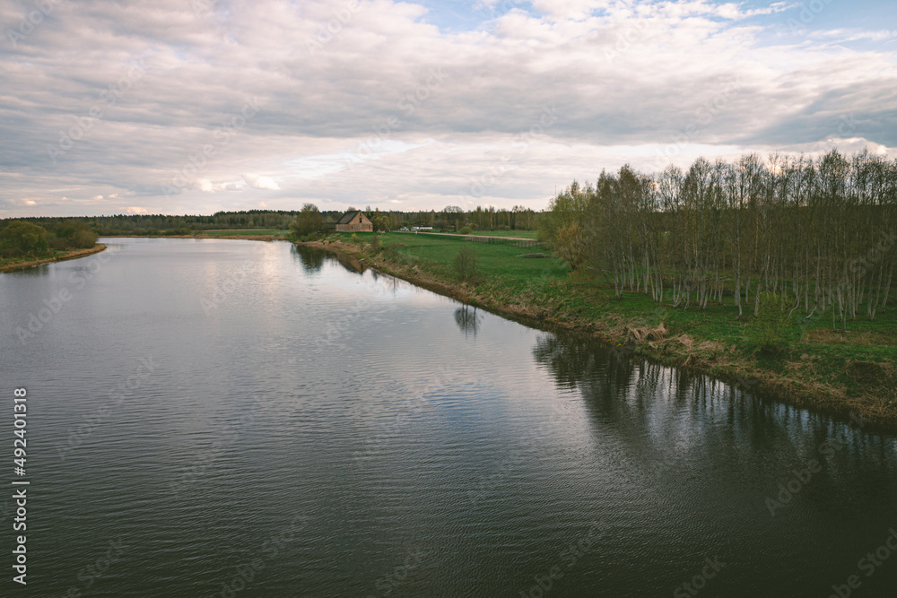 landscape with river Lielupe near Jelgava town, Latvia in spring evening