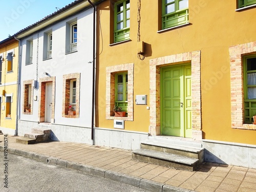 Streer view of Colorful houses in row  © jon_chica