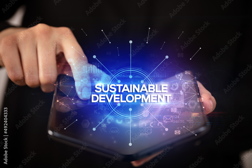 Businessman holding a foldable smartphone, new business concept