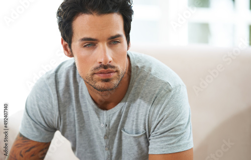Irresistible good looks. Cropped shot of a handsome young man deep in thought.