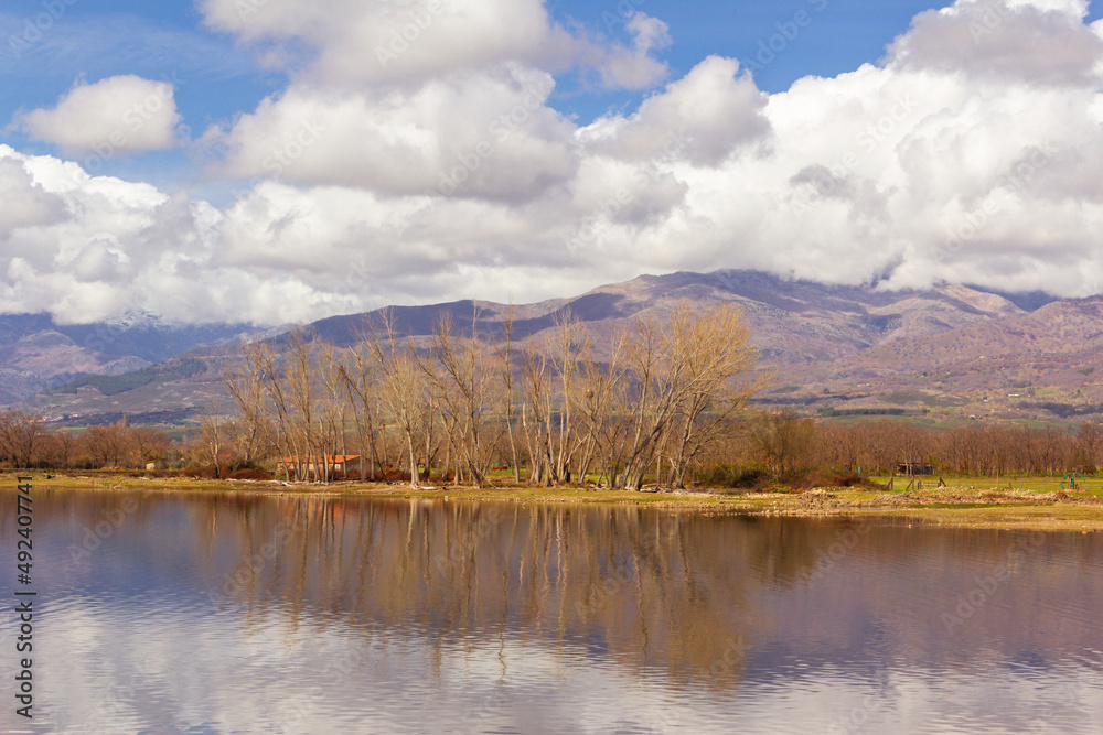Gredos mountain landscape, in Spain, reflected on the water of a lake on a cloudy day. Selective focus. Tourism. Gredos mountain landscape, in Spain, reflected on the water of a lake on a cloudy day. Selective focus. Tourism.