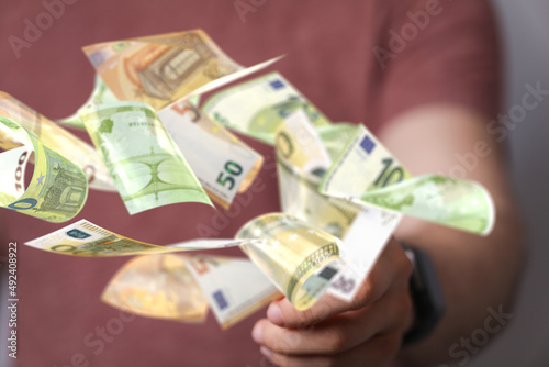 euro bills flying around  i...