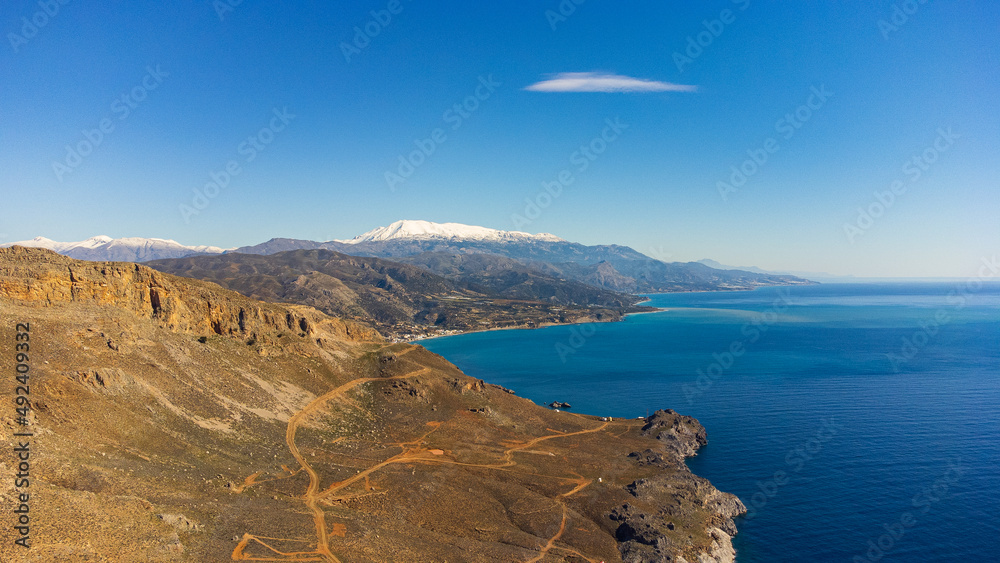 Scenic aerial shot of a beautiful landscape with mountains and the sea in Crete, Greece
