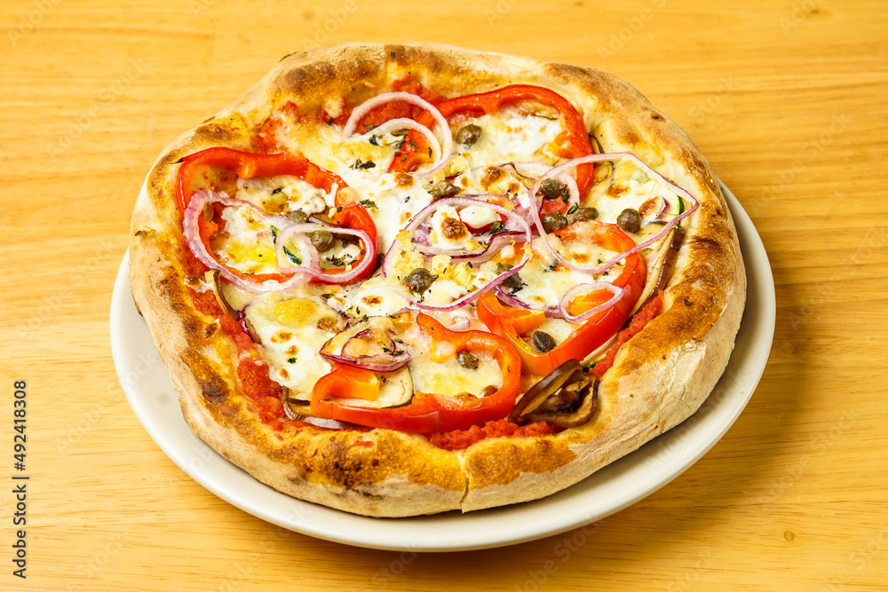 Pizza with red peppers, capers, mozzarella, pecorino, red onions