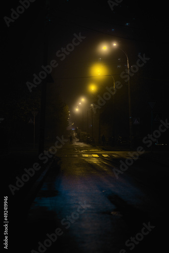 night empty road with blue and yellow light