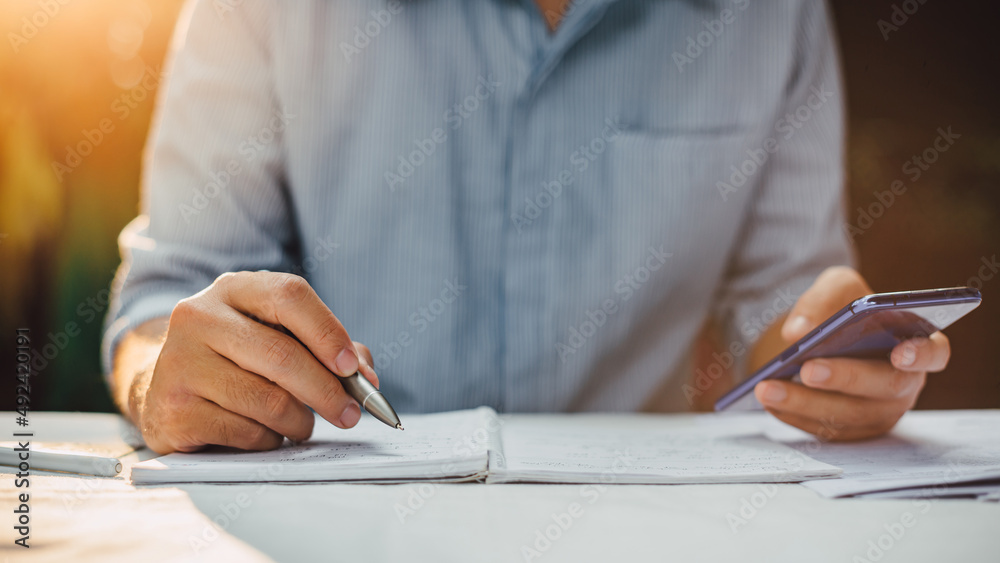 businessman working on project for analyzing company financial report balance statement with documents. Concept of business, economy, marketing, accounting and tax. businessman working on project for analyzing company financial report balance statement with documents. Concept of business, economy, marketing, accounting and tax.