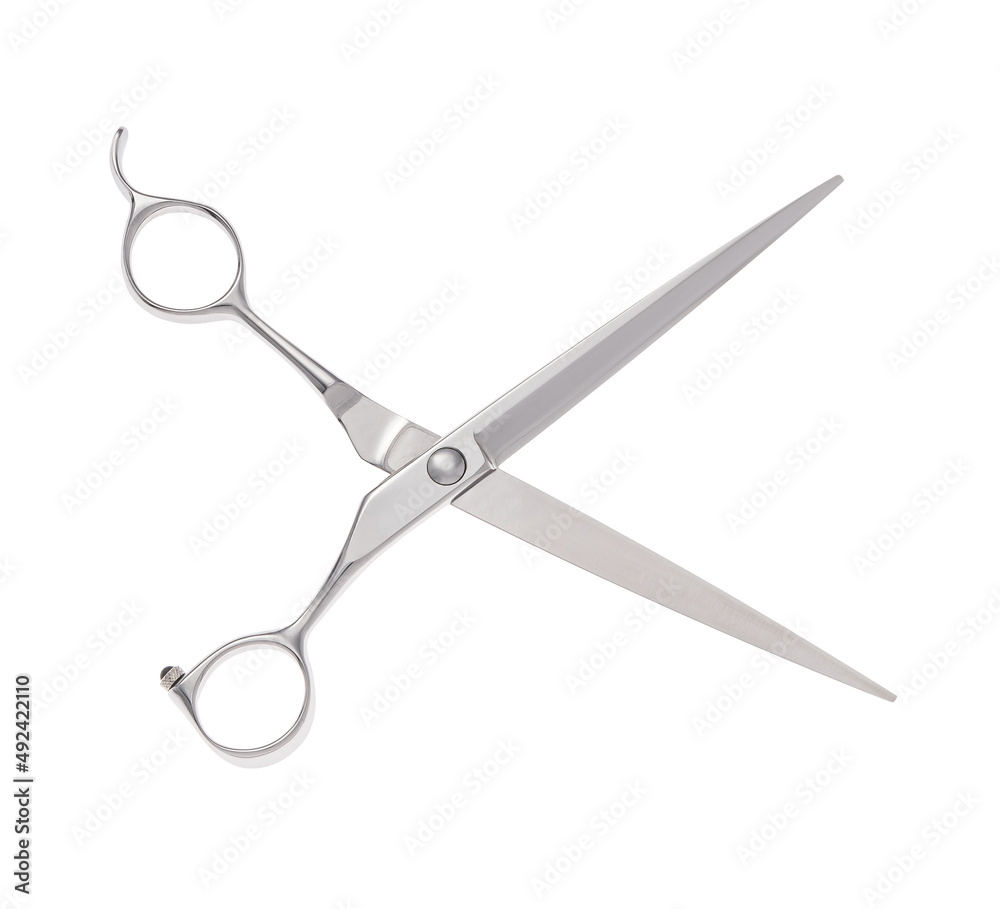 Scissors for cutting people and pets. Grooming scissors. Opened scissors on a white isolated background. Side view.
