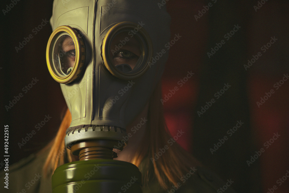 military girl in a gas mask against radiation Stock Photo | Adobe Stock