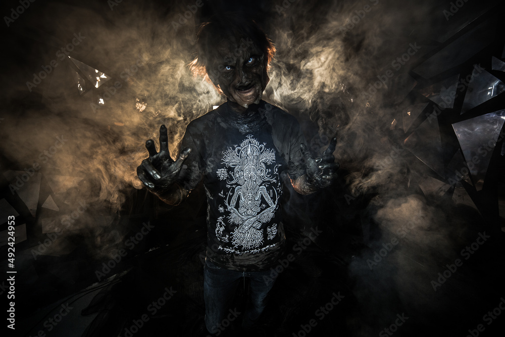 scary sorcerer in smoke. voodoo rite scary sorcerer in smoke. voodoo rite
