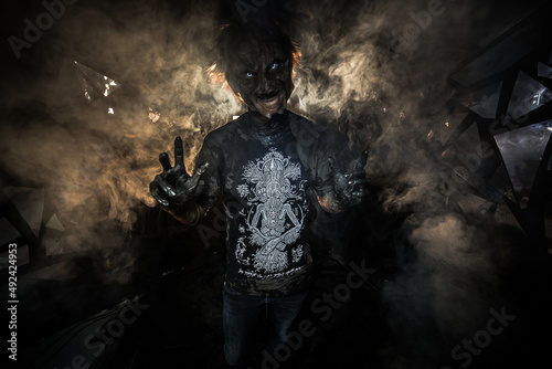scary sorcerer in smoke. voodoo rite
