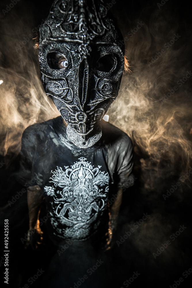 scary sorcerer in smoke. voodoo rite scary sorcerer in smoke. voodoo rite