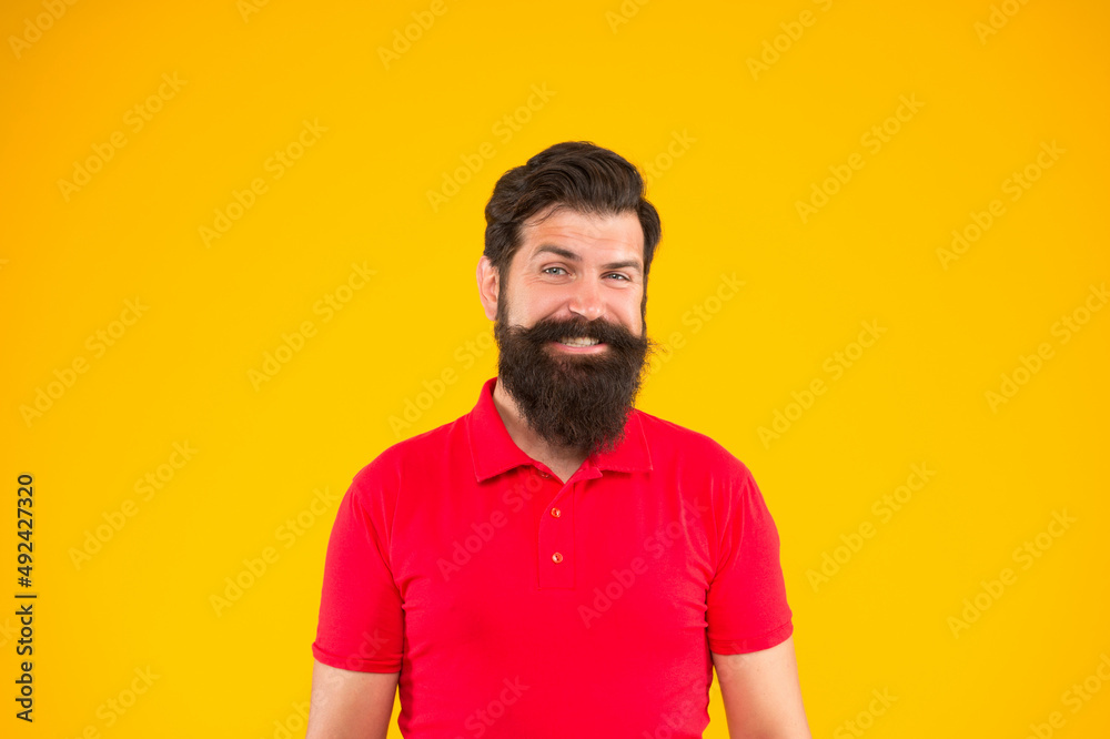 confident and handsome bearded man on yellow background. hair and beard care. confident and handsome bearded man on yellow background. hair and beard care.