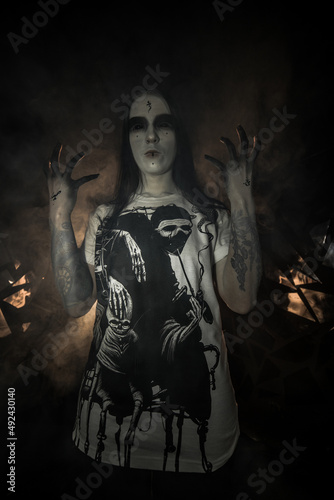 Fototapeta Naklejka Na Ścianę i Meble -  the sorceress stands in the smoke. voodoo rite