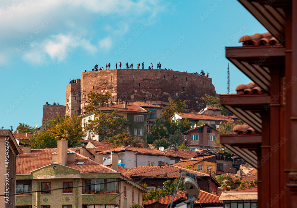 People observing the beautiful scenery from the top of Ankara Kalesi | Ankara Castle. Distant shot of Ankara Castle from Hamamonu district.