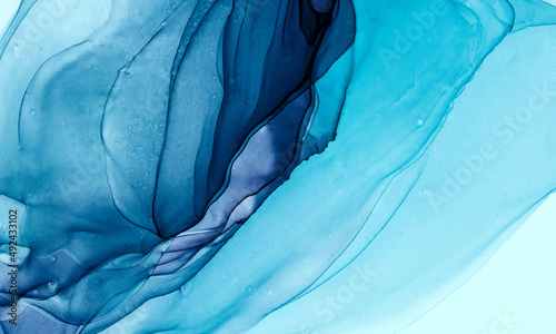 Abstract alcohol ink background in blue purple tones