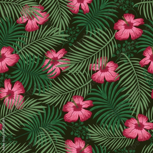 Tropical floral colorful seamless pattern on a black background with beautiful flowers green palm leaves vector