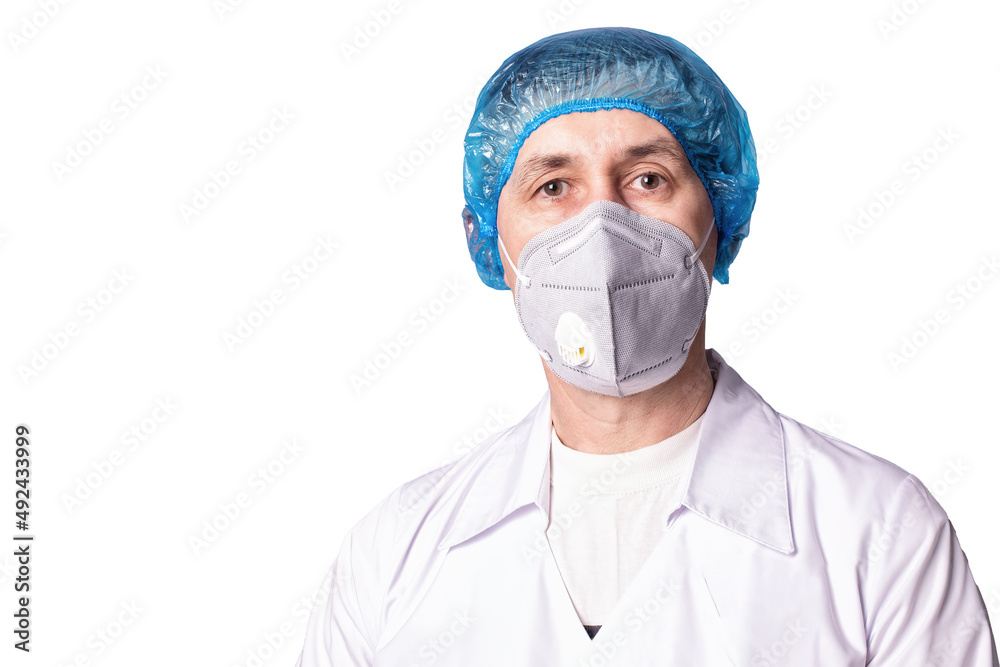 A doctor wearing medical respirator and uniform on white background, isolated. COVID-19 protection. A doctor wearing medical respirator and uniform on white background, isolated. COVID-19 protection.