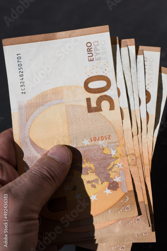 The concept of cash payment. Paper money in hand.