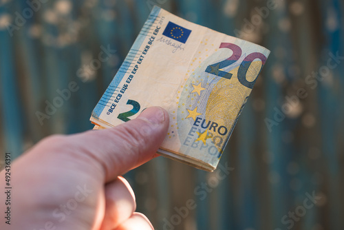 The concept of cash payment. Paper money in hand.