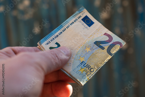 The concept of cash payment. Paper money in hand.