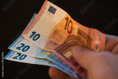 The concept of cash payment. Paper money in hand.