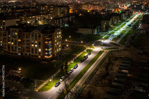 Fototapeta Naklejka Na Ścianę i Meble -  Night panorama of Light in the windows of a multistory building. life in a big city