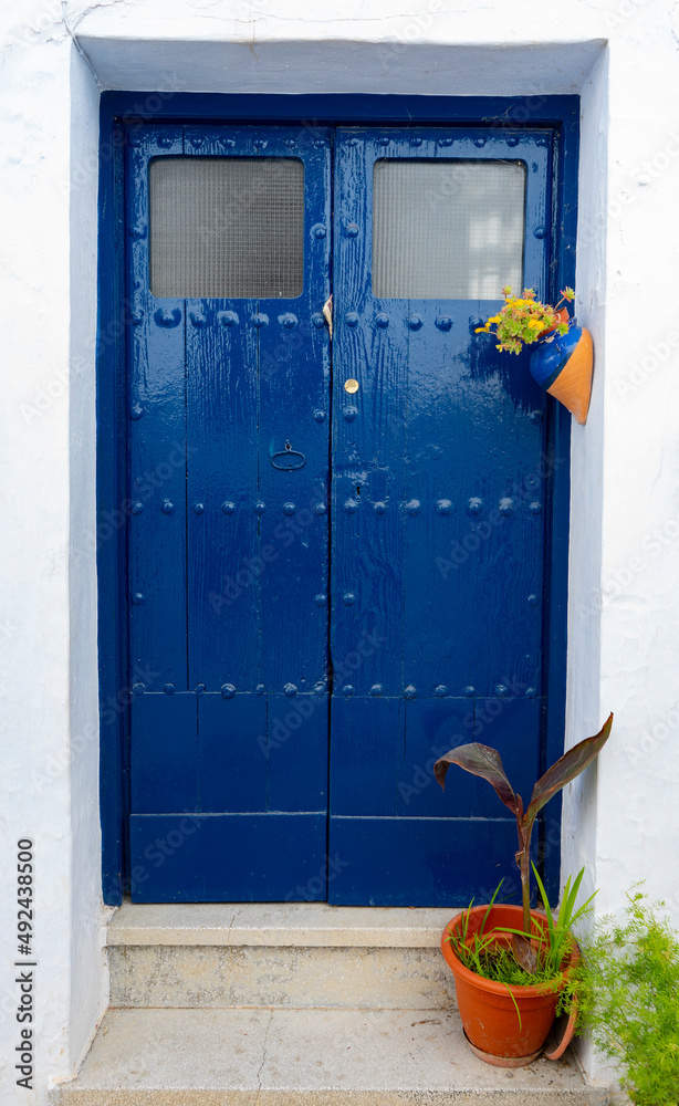 PUERTA AZUL EN UN PUEBLO DE ANDALUCIA Stock Photo | Adobe Stock