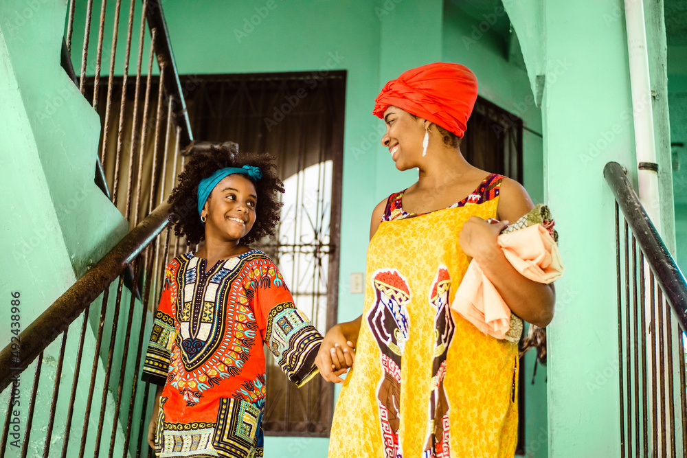 black woman mother and daughter together, culture and traditional concept.
