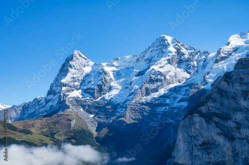 Mountains and clouds in the valley. Natural landscape high in the mountains. ...