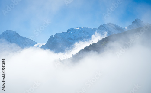 Mountain range through the clouds. Landscape in the summertime. Large resolut...