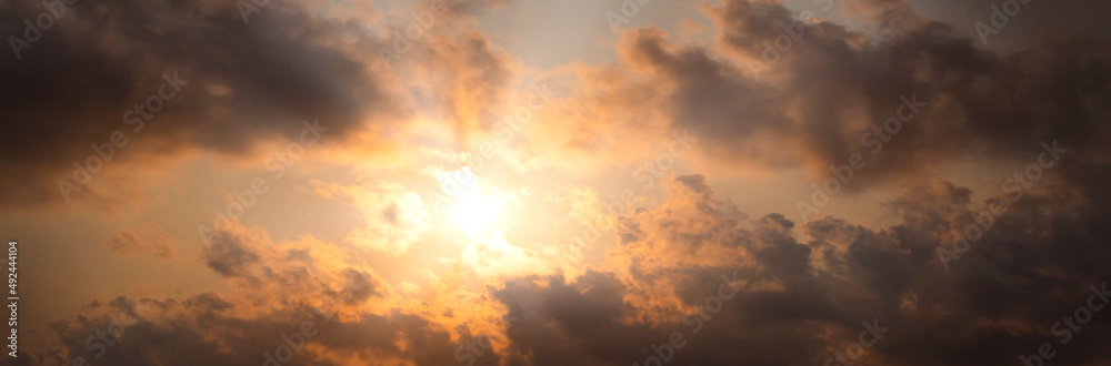 sunrise with  a cloud in the orange sky