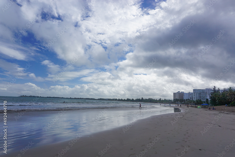 Isla Verde Beach, Puerto Rico, USA: Palm trees and hotels on a beach in Puerto Rico.